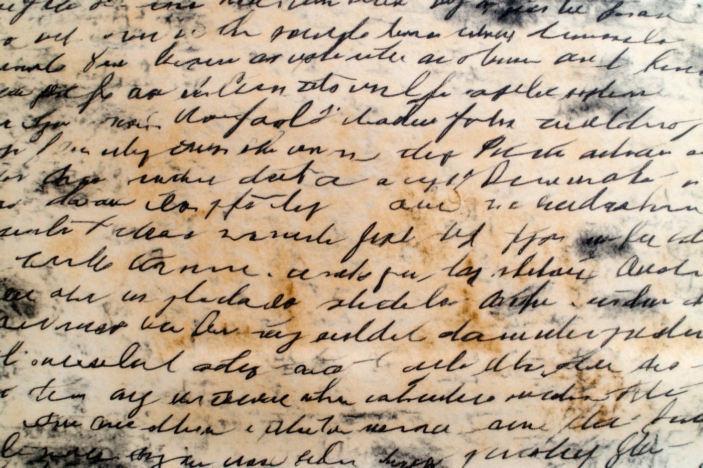 Close-up of cursive handwriting on an aged manuscript